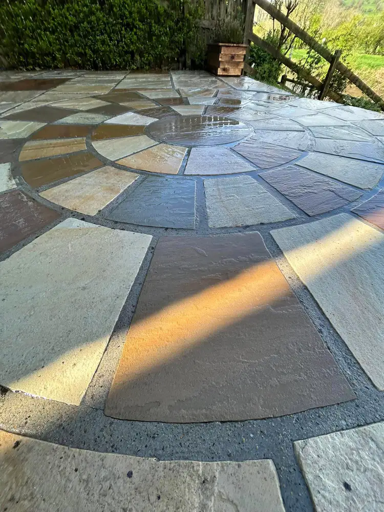 Wet sandstone patio cleaning